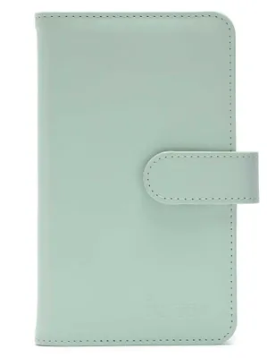 A mint green Instax Mini 12 album is shown against a white background.