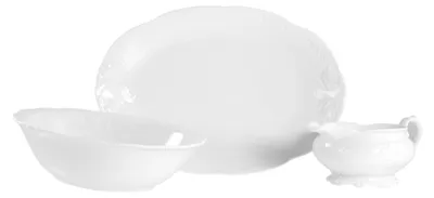 A white porcelain serving set consisting of a large platter, a bowl, and a gravy boat, arranged on a white background.