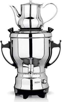 A stainless steel electric samovar with a teapot on top, placed on a white background.