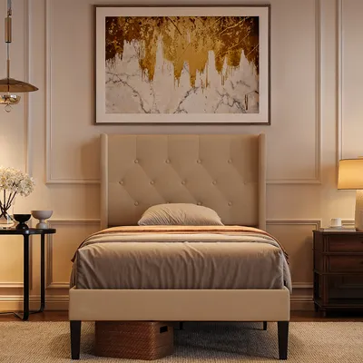 A bedroom scene with a bed, nightstand, and artwork.