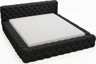A black tufted bed frame with a white mattress on a white background.