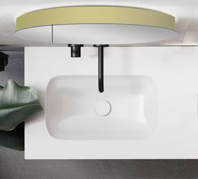 A modern bathroom vanity with a sink and faucet, viewed from above.