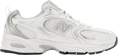 A side view of a white New Balance 530 sneaker.