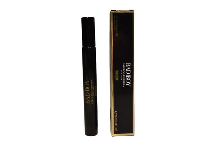 A black perfume bottle and its matching black and gold box are displayed against a white background.