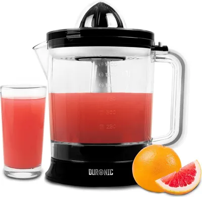 A citrus juicer with a glass of juice and a grapefruit next to it.