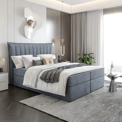 A bedroom with a large bed.
