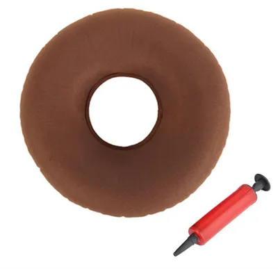 A brown donut-shaped cushion and a red hand pump are shown against a white background.