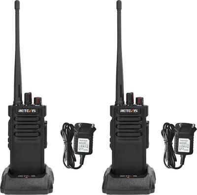 Two black Retevis RT29D walkie-talkies with charging docks and power adapters, presented against a white background.