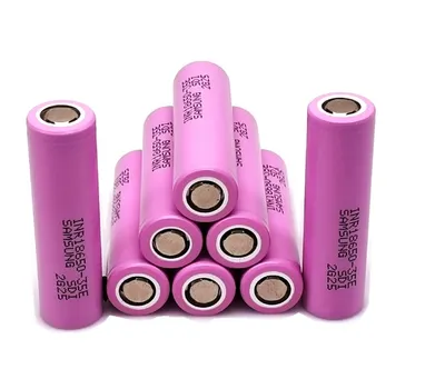 A group of pink Samsung 18650 lithium-ion batteries are arranged in a pyramid shape against a white background.