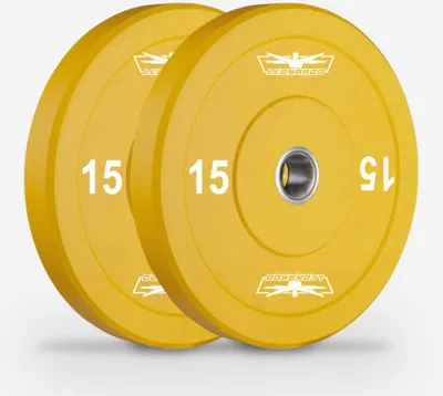 Two yellow weight plates with a silver center hole, placed side-by-side on a light gray background.