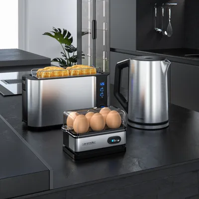 Kitchen counter with a toaster, electric kettle, and egg cooker.