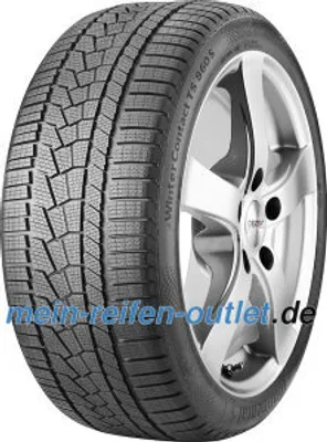 A close-up of a car tire mounted on a silver alloy wheel, shown against a white background.