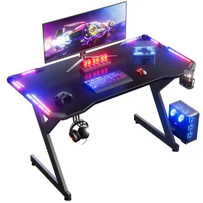 Obrázok produktu pre Herný stôl - počítačový stôl 120 cm - Y-tvarová konštrukcia - RGB LED osvetlenie - Ergonomická povrchová úprava z uhlíkových vlákien - Držiak na slúchadlá - Držiak na poháre