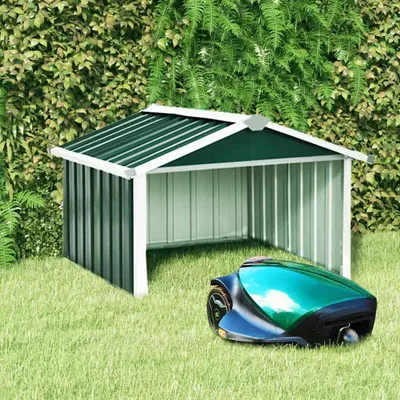 A green and white mower garage with a green robotic lawn mower in front of it, set against a backdrop of lush green foliage.