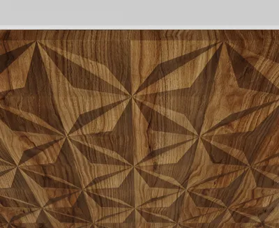 A close-up, top-down view of a wooden surface with a geometric, star-like pattern carved into it.