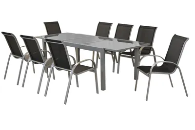 A set of outdoor dining furniture, including a table and chairs, arranged on a white background.