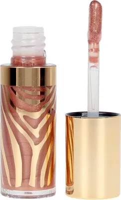 A bottle of lip gloss with its applicator wand next to it.