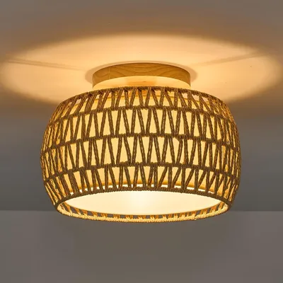 A close-up shot of a ceiling light fixture with a woven rattan shade.