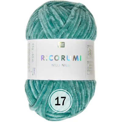 A ball of turquoise yarn with a label.
