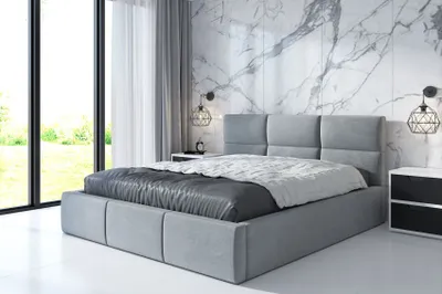 A modern bedroom with a large bed, marble accent wall, and large windows.