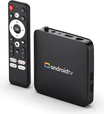 A black Android TV box and its remote control are displayed against a white background.