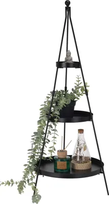 A black metal tiered stand with decorative items on each tier.