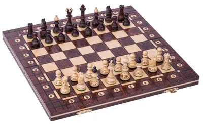 A chess set with pieces arranged on the board, viewed from a diagonal angle.