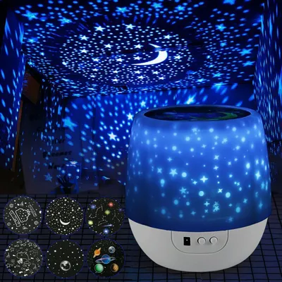 A star projector lamp is shown projecting stars and a moon onto a ceiling and walls. Several circular film inserts with different patterns are displayed in the lower left corner.
