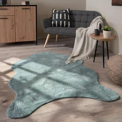 Produktbild von Teppich Wohnzimmer Kurzflor Modernes Kunstfell Fellform Weich Einfarbig Rutschfest Grösse 60x90 cm Fell-form