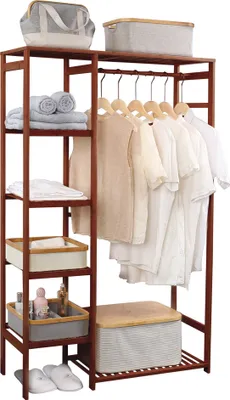 A wooden garment rack with clothes hanging on it and storage bins on shelves.