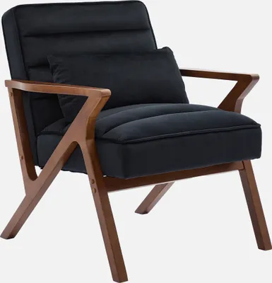 A black velvet armchair with wooden legs and arms, shown against a plain light gray background.