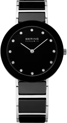 A close-up studio shot of a women's Bering ceramic watch with a black dial and silver and black ceramic band.