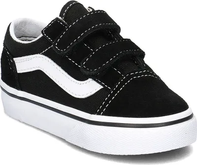 A black and white Vans Old Skool V shoe with velcro straps.