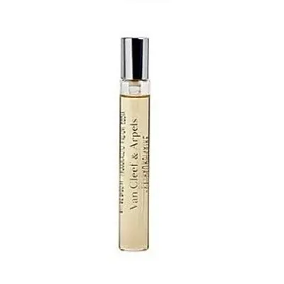 A miniature perfume bottle with a silver cap and clear glass, filled with a light yellow liquid.