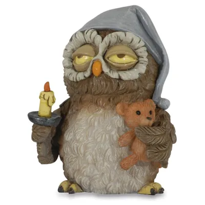 A figurine of a sleepy owl wearing a nightcap, holding a candle and a teddy bear.