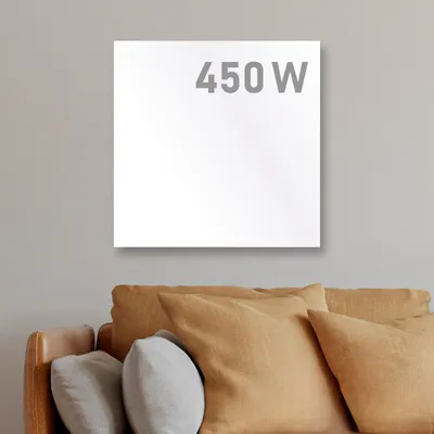 A white infrared heater with '450 W' text is mounted on a light gray wall above a sofa with brown and gray cushions.