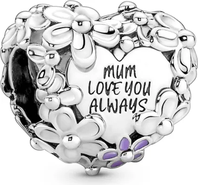 A silver heart-shaped charm with flowers and text.