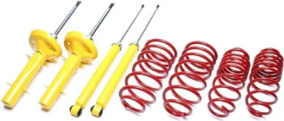 A set of car suspension components, including shock absorbers and coil springs, arranged on a white background.