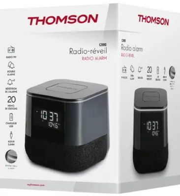 The image shows the retail packaging of a Thomson radio alarm clock. The box displays images of the product and lists its features.