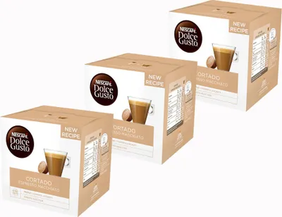 Three boxes of Nescafé Dolce Gusto Cortado Espresso Macchiato coffee capsules are arranged diagonally on a white background.