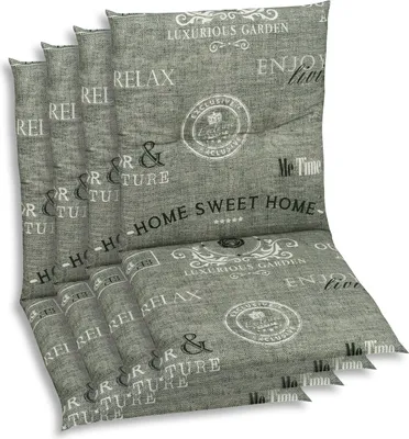 A stack of grey chair cushions with text and decorative elements printed on them.