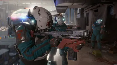 Three figures in futuristic medical-style uniforms stand in a dimly lit, cluttered environment. The figure in the foreground holds a large weapon.