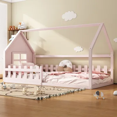 A child's bedroom with a pink house-shaped bed.