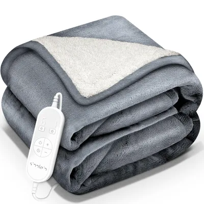 A folded gray electric blanket with a white sherpa lining and a controller.
