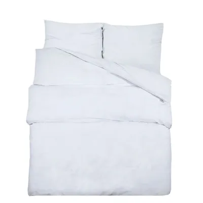 A white duvet cover and pillow set laid out flat.