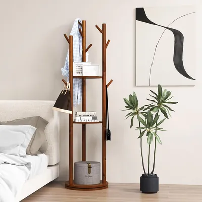 A wooden coat rack with shelves is shown next to a bed and a plant in a room.