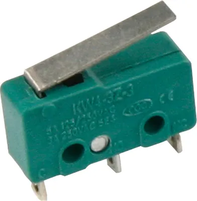 A close-up studio shot of a green microswitch with a silver lever.