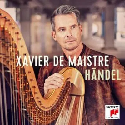A man is holding a harp, with text overlayed on the image.