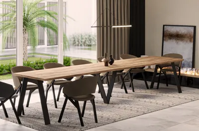 A dining room with a long wooden table and chairs, set in a modern home with large windows and a fireplace.