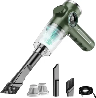 A green portable vacuum cleaner with various attachments and accessories, displayed against a white background.